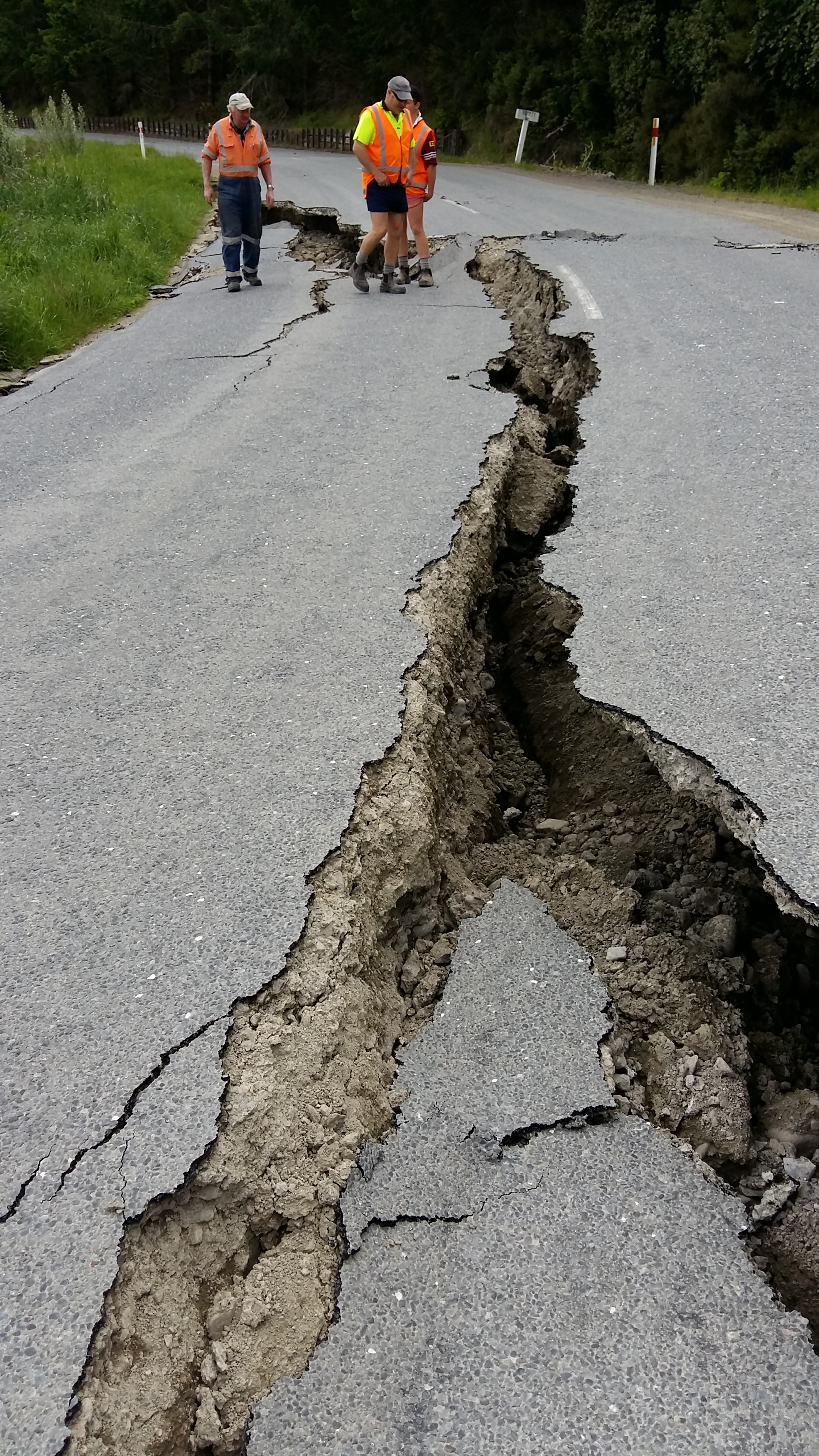 Picture showing deep cracks in a road following an earthquake. 