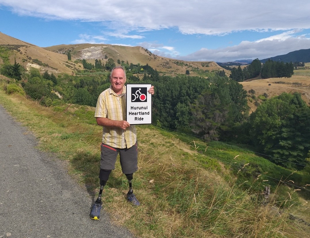 Photo: Mark Inglis with a Hurunui Heartland Ride official sign from NZTA. 